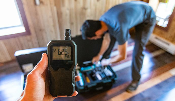 Professional worker inspecting air quality