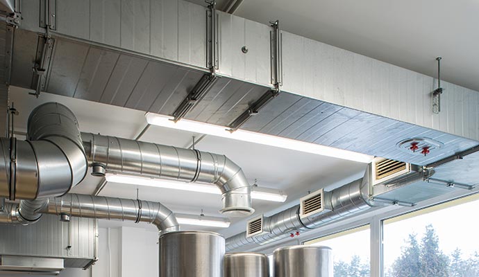 Insulated HVAC duct system installed on the ceiling of a commercial building