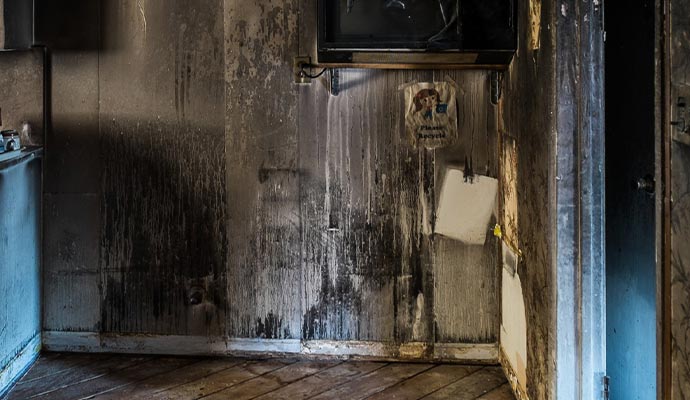 Wall covered in smoke soot and stains